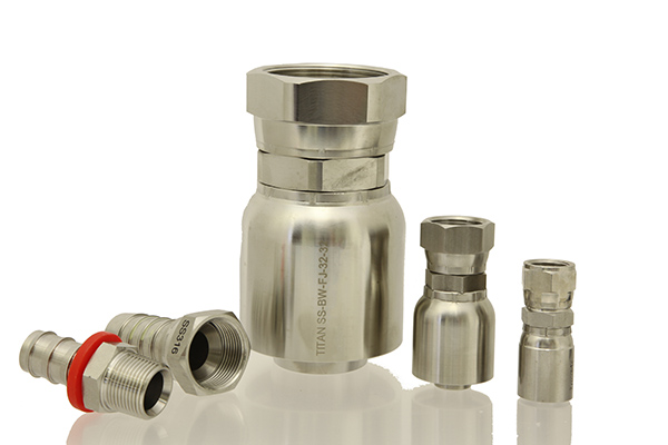 A photograph of five stainless steel fittings sold by Titan Fittings on the white background